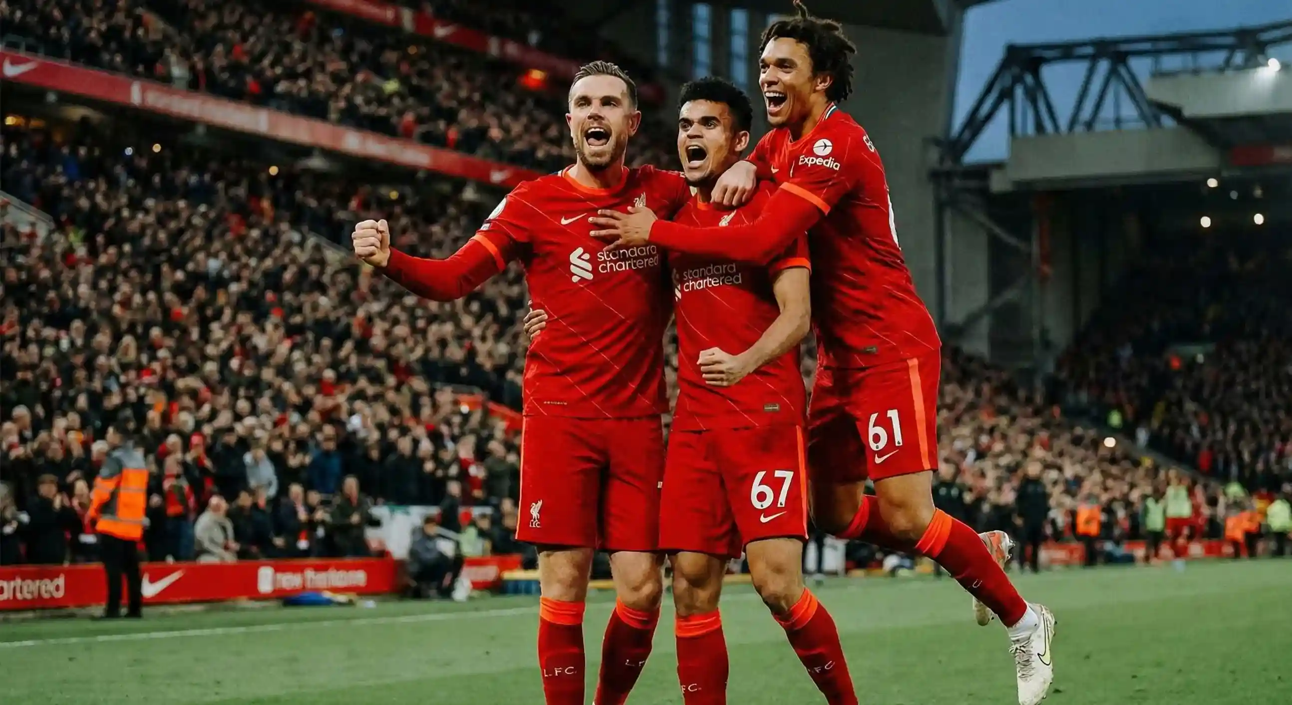 Football players celebrating a goal together on the pitch