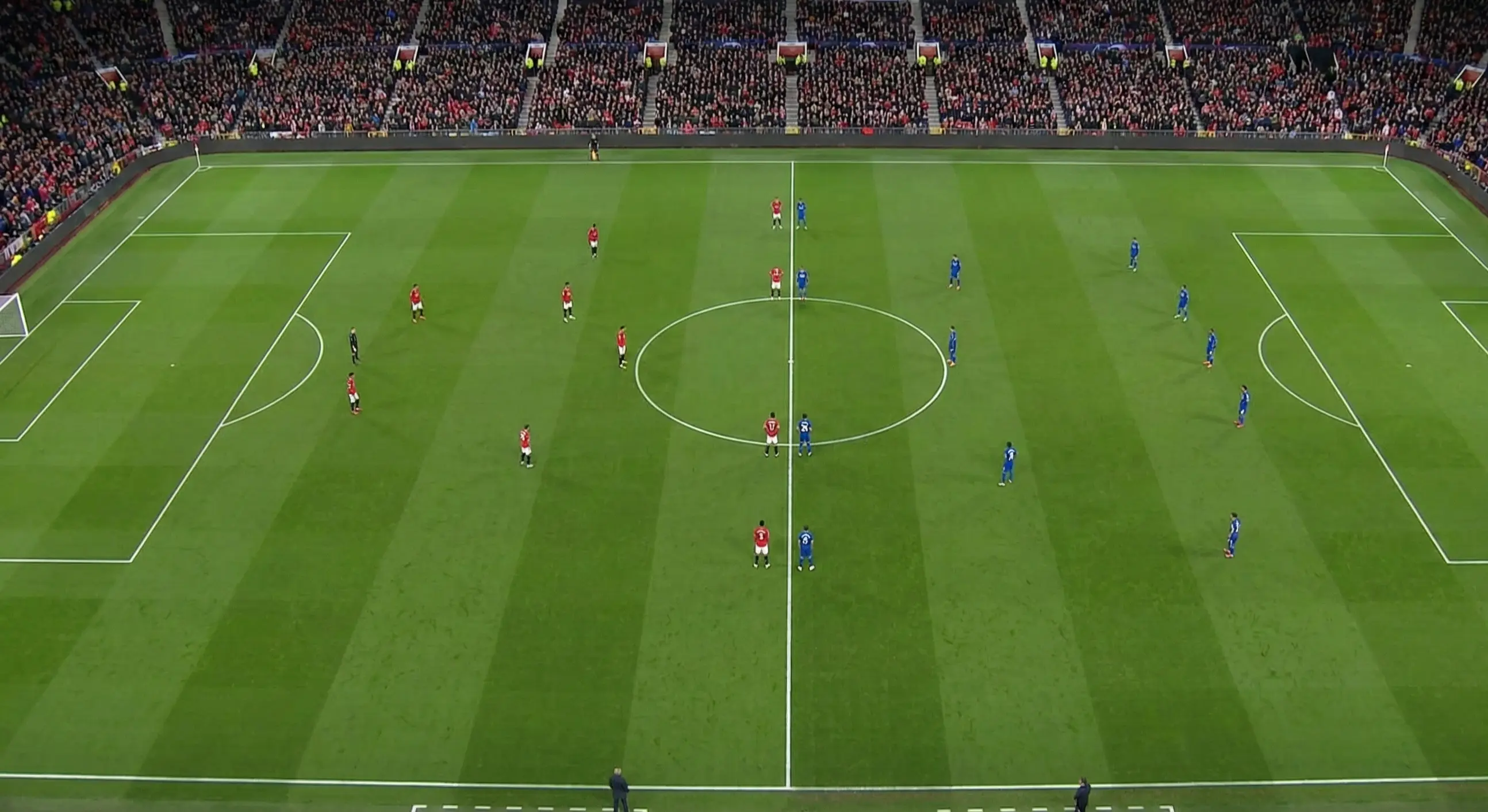Aerial view of a football match with players positioned across the pitch
