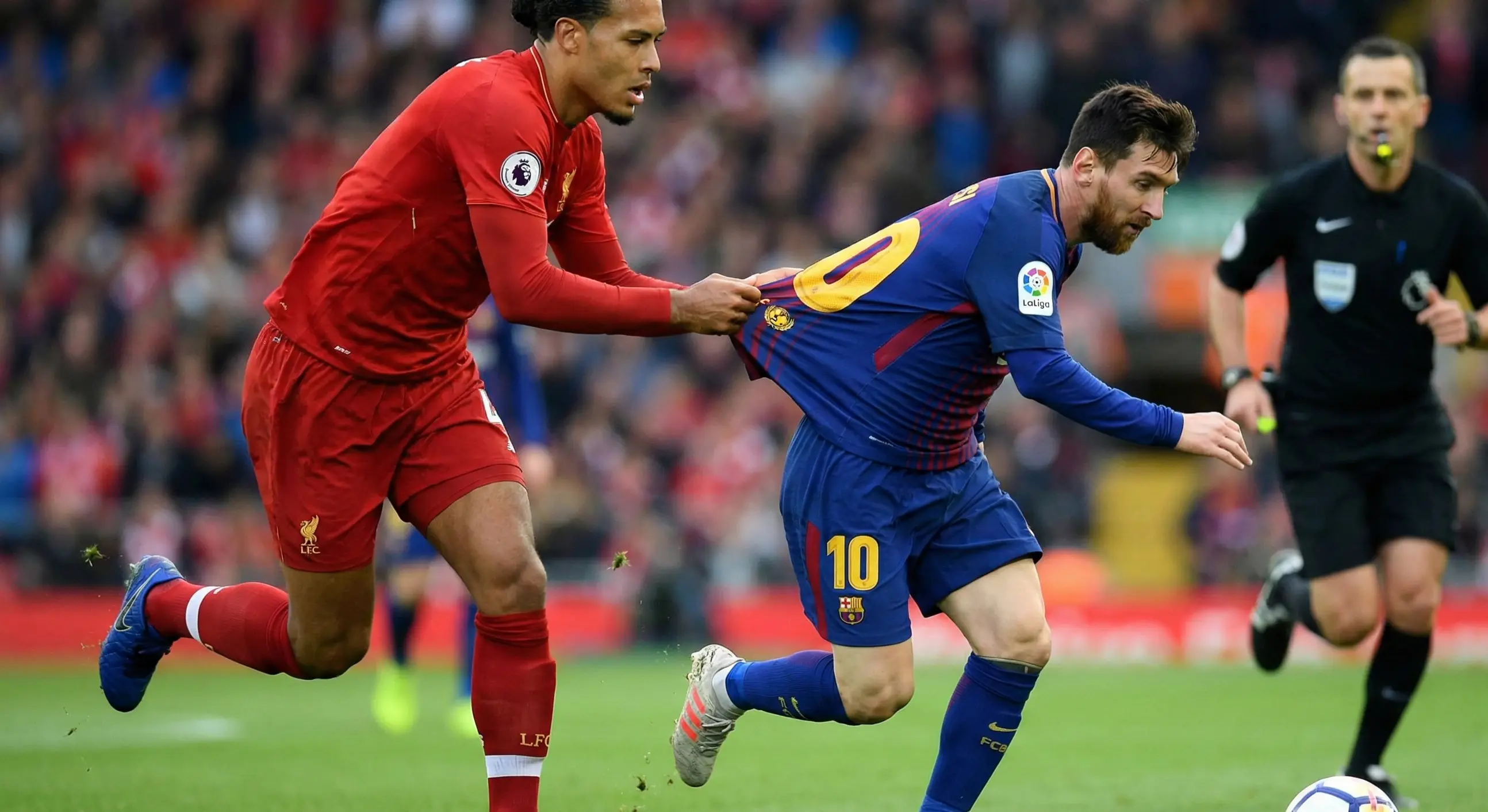 Football player committing a tactical foul by grabbing an opponent's jersey
